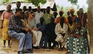 Image shows people posing, seated and standing