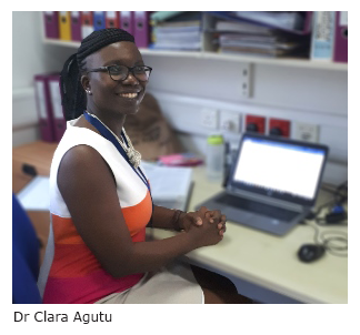 Photo of Clara at her desk