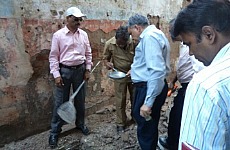 Photo shows five people carrying out larvae surveillance