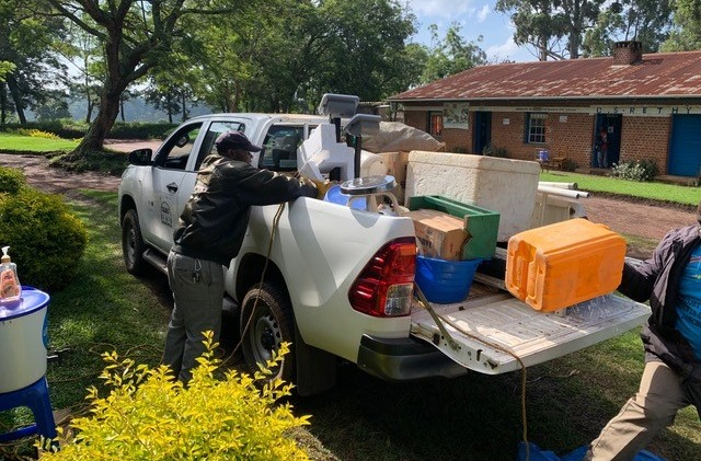 A study vehicle is being loaded at CRMT in Rethy with some of the material needed for examining study participants in their community.